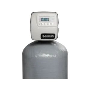 Water softener control head mounted on a large grey resin tank, showing a digital display and buttons (ECOSOFT).