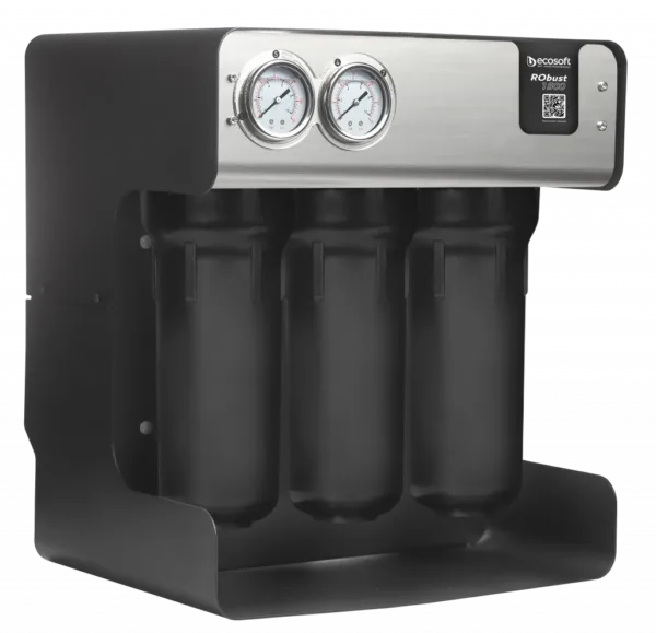 Four-filter industrial water filtration unit with four vertical cartridges and two pressure gauges on a brushed metal panel