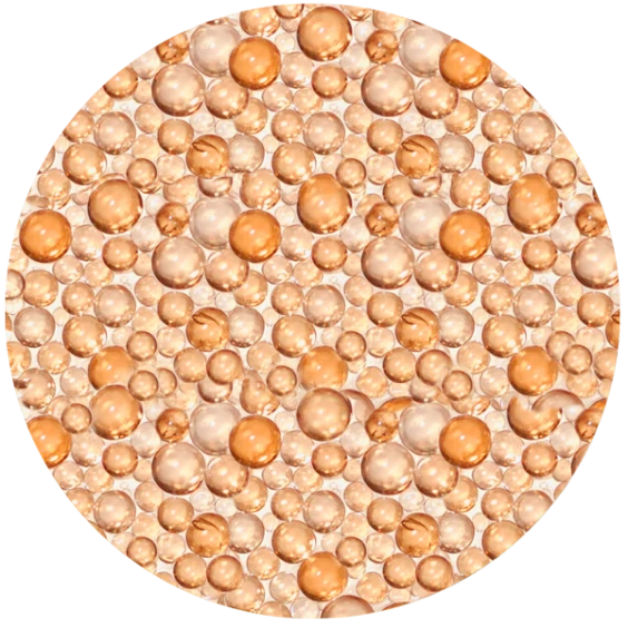 Close-up of numerous small peach- and copper-colored beads filling a circular frame.